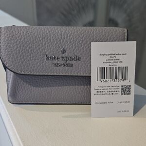 kate spade Pebbled Leather Wallet in Light Gray with Silver Logo